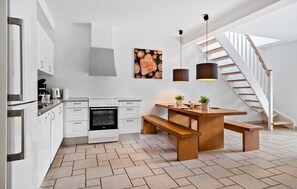 Fridge, stovetop, dishwasher, coffee/tea maker