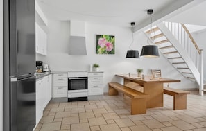 Fridge, stovetop, dishwasher, coffee/tea maker