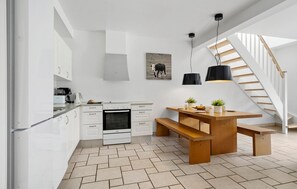 Fridge, stovetop, dishwasher, coffee/tea maker