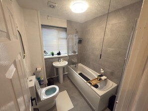 Shower, hair dryer, towels, soap
