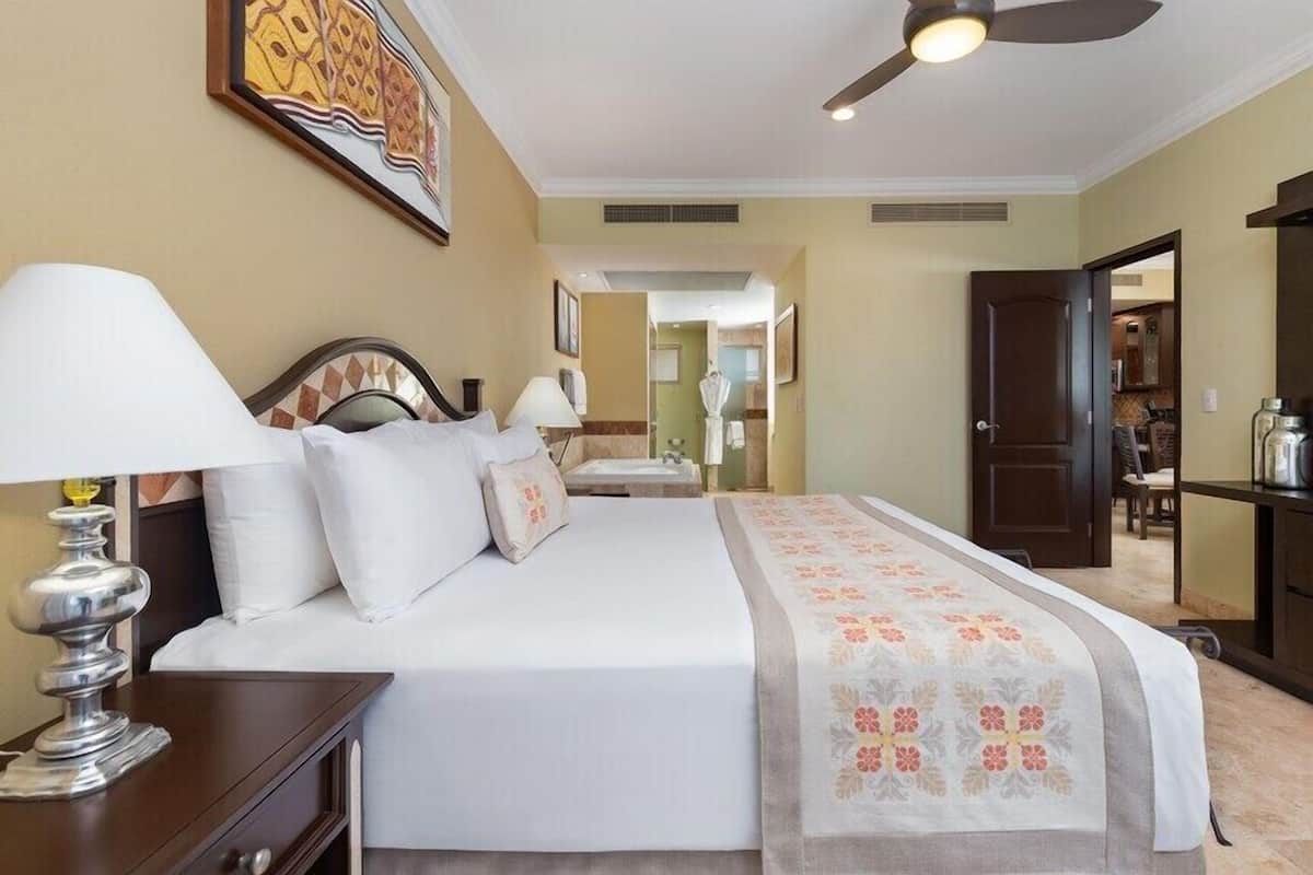 Deluxe Suite, 2 Bedrooms, Kitchen, Partial Ocean View | In-room safe, blackout drapes, iron/ironing board, WiFi