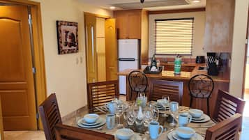 Deluxe Suite, 2 Bedrooms, Kitchen, Partial Ocean View | Private kitchen | Coffee/tea maker