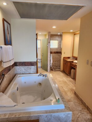 Deluxe Suite, 2 Bedrooms, Kitchen, Partial Ocean View | Bathroom | Hair dryer, towels, soap, shampoo