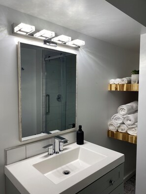 Shower, hair dryer, towels, soap