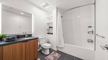 Hair dryer, towels, soap, toilet paper