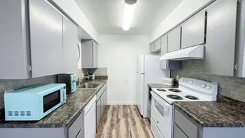 Fridge, stovetop, dishwasher, coffee/tea maker