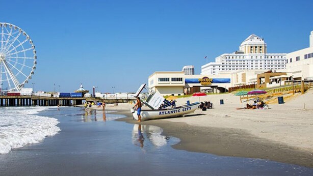 A beachside hotel with a Ferris wheel, a pier, and a beachfront view. - AC’s Finest! (Atlantic City)