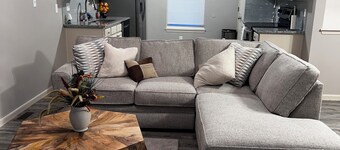 Charming 1-bedroom house with AC, and a shared living and kitchen space.