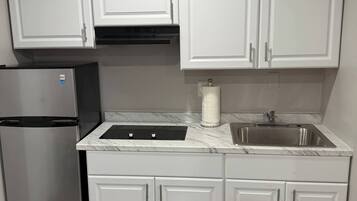 Microwave, stovetop, coffee/tea maker, cookware/dishes/utensils