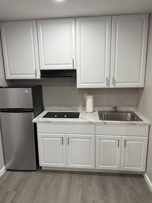 Microwave, stovetop, coffee/tea maker, cookware/dishes/utensils