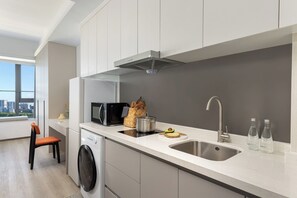 Basic Double Room, City View | Private kitchen | Fridge, microwave, stovetop, electric kettle