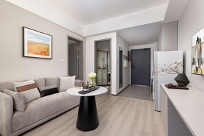 Executive Suite, City View | Living room | LCD TV, pay movies, smart speakers