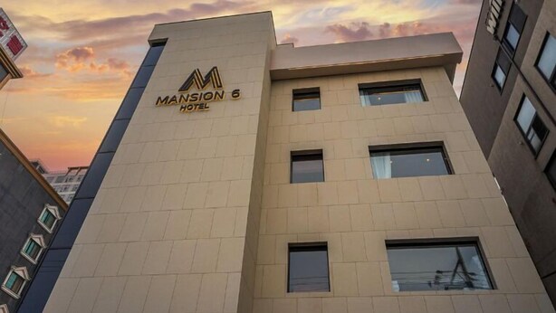 A modern hotel building with the name 'Mansion 6 Hotel' on its facade. - POHANG MANSION 6 HOTEL (Pohang)