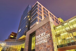 A modern hospital building with a prominent sign reading "EMORY UNIVERSITY HOSPITAL". - Safari Getaway: MBenz & Beltline (Atlanta)