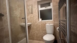 A bathroom with a glass shower enclosure, a pedestal sink, and a toilet. - Curzon St - 4 Beds, Sleeps 7 with Street Parking (Reading)