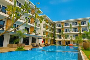 Outdoor pool, open 7:00 AM to 10:00 PM, pool umbrellas, pool loungers - Revery Hotel Siem Reap (Siem Reap)