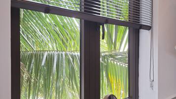 Deluxe Twin Room, Garden View | Minibar, in-room safe, desk, laptop workspace