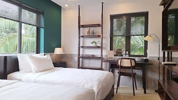 Deluxe Twin Room, Garden View | Minibar, in-room safe, desk, laptop workspace