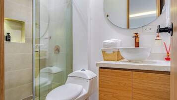 Shower, rainfall showerhead, hair dryer, towels