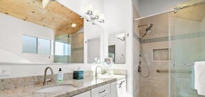 Shower, hair dryer, towels, shampoo