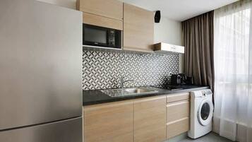 Fridge, microwave, coffee/tea maker, toaster