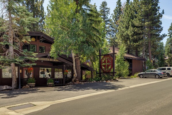 A lodge with a rustic exterior, large windows, and a prominent entrance.