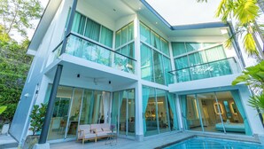 A modern two-story house with large glass windows, a balcony, and a swimming pool. - NicestInPhuket4Br1.5kmBangTao BeachV141 (Choeng Thale)