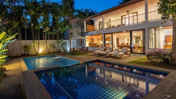 A two-story house with a swimming pool, outdoor seating, and a balcony. - CoconutPalmsJacuzzipoolhugeproperty v136 (Rawai)