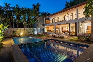 A two-story house with a swimming pool, outdoor seating, and a balcony. - CoconutPalmsJacuzzipoolhugeproperty v136 (Rawai)