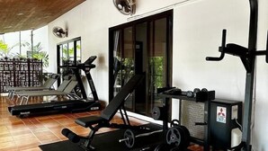 A gym with exercise equipment, a bench, and a weight rack. - CoconutPalmsJacuzzipoolhugeproperty v136 (Rawai)