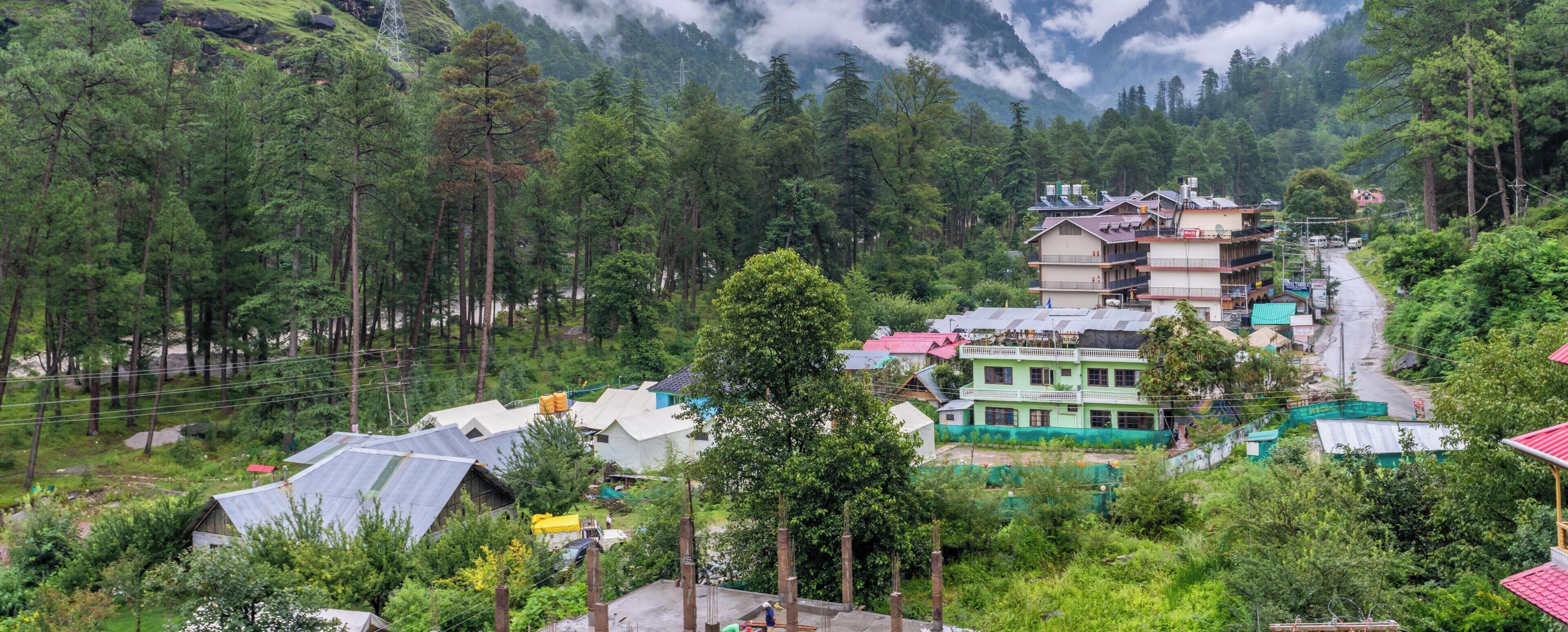 A mountainous village with traditional houses and a clear view of the valley below.