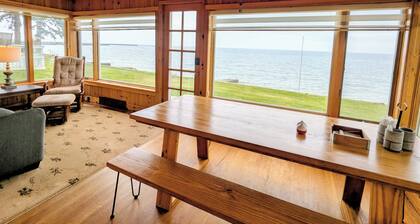 Lakefront Cottage with Private Beach, large yard, walk to town. Sleeps 6
