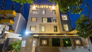 A modern building with a sign reading "ALISTEV" at the top. - Aliste millennium City centre, Fortis, Gurugram (Gurugram)