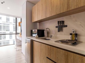 Fridge, microwave, stovetop, coffee/tea maker