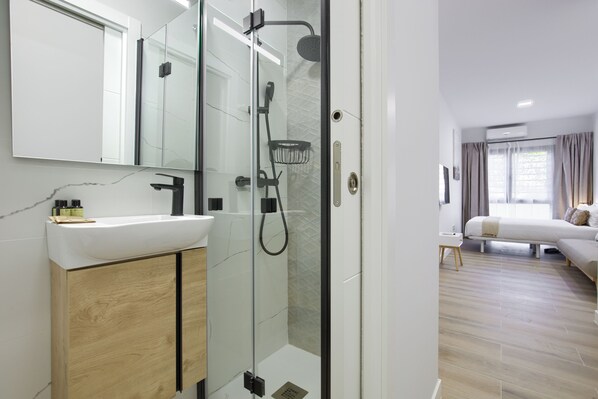 Standard Double Room, Ground Floor | Bathroom | Shower, towels, soap, shampoo