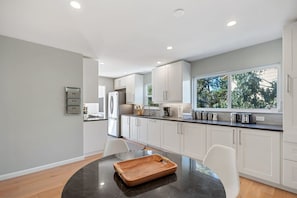 House (3 Bedrooms) | Private kitchen | Microwave, oven, coffee/tea maker, dining tables
