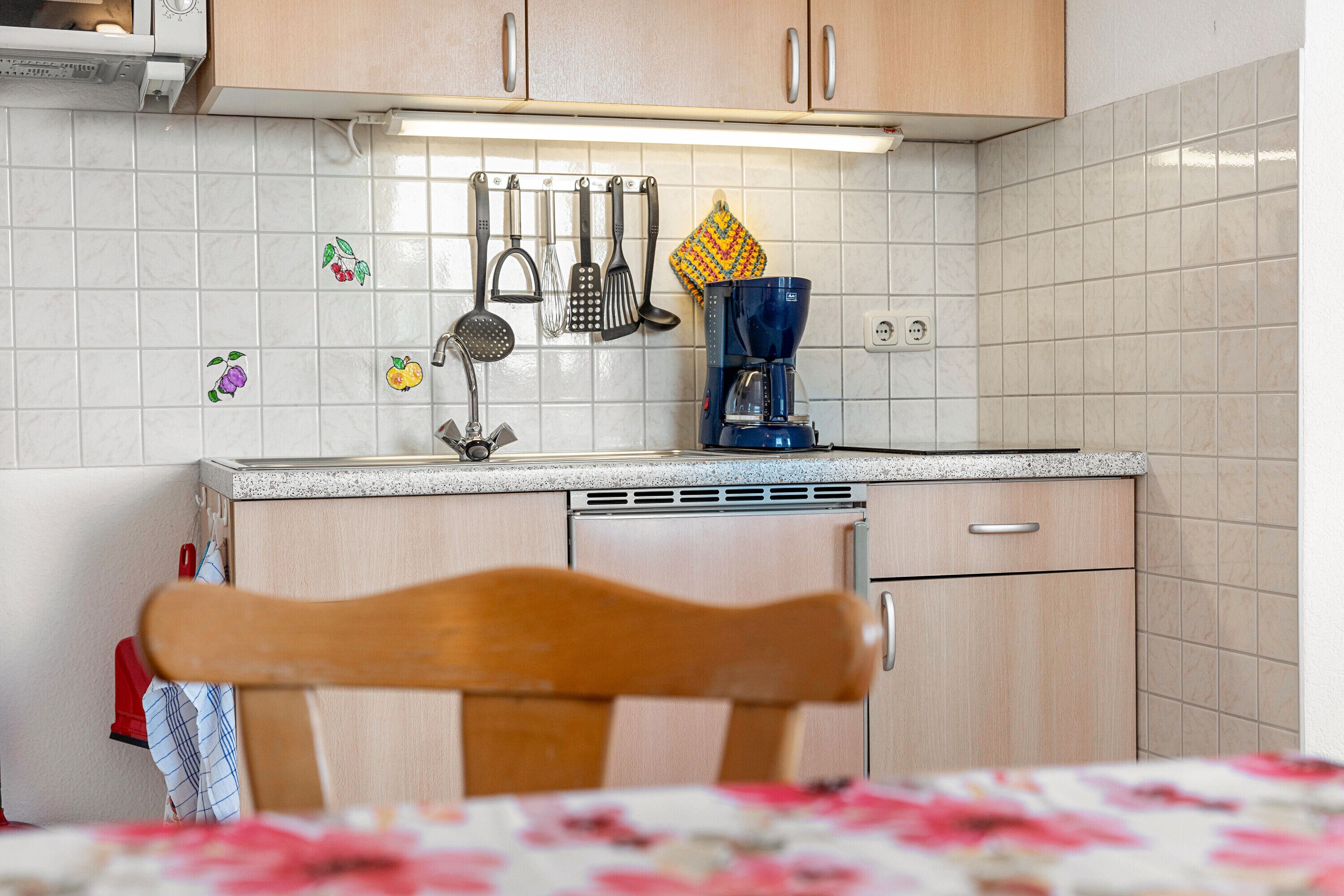 Fridge, microwave, stovetop, coffee/tea maker