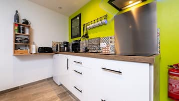 Fridge, microwave, stovetop, coffee/tea maker