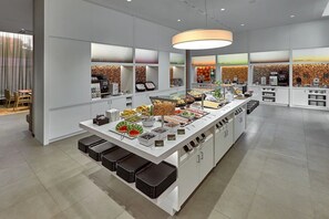 A modern breakfast bar with a variety of food options and a coffee station. - Complimentary Breakfast & City Views! Pergamon Museum - 0.9 mile away! (Berlin)