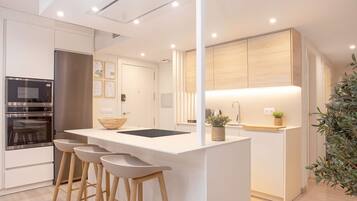 Apartment (3 Bedrooms) | Private kitchen | Fridge, microwave, oven, stovetop