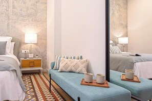 2 dormitorios, tabla de planchar con plancha, ropa de cama