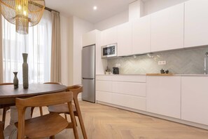 Apartment (4 Bedrooms) | Private kitchen | Fridge, microwave, dishwasher, highchair
