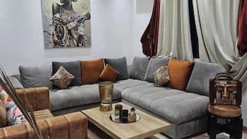 Superior Suite, Patio, City View | Living area