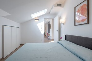 1 bedroom, desk, iron/ironing board, travel crib