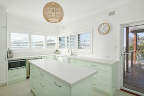 Fridge, stovetop, dishwasher, coffee/tea maker
