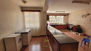 A kitchen with a refrigerator, stove, and a sink. - Tina's ngong hills cottage - country living (Kajiado County)