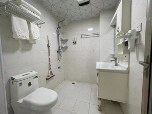 Shower, hair dryer, towels, shampoo
