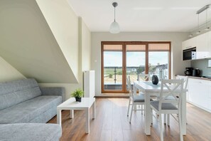 TV, offices - Bright Apartment in Puck | Close to the Sea, Balcony (Puck)