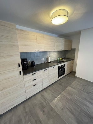 Fridge, stovetop, dishwasher, electric kettle