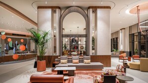 A modern lobby with a central seating area, a reception desk, and large windows. - Trendy Perge Resort & Suites (Antalya)